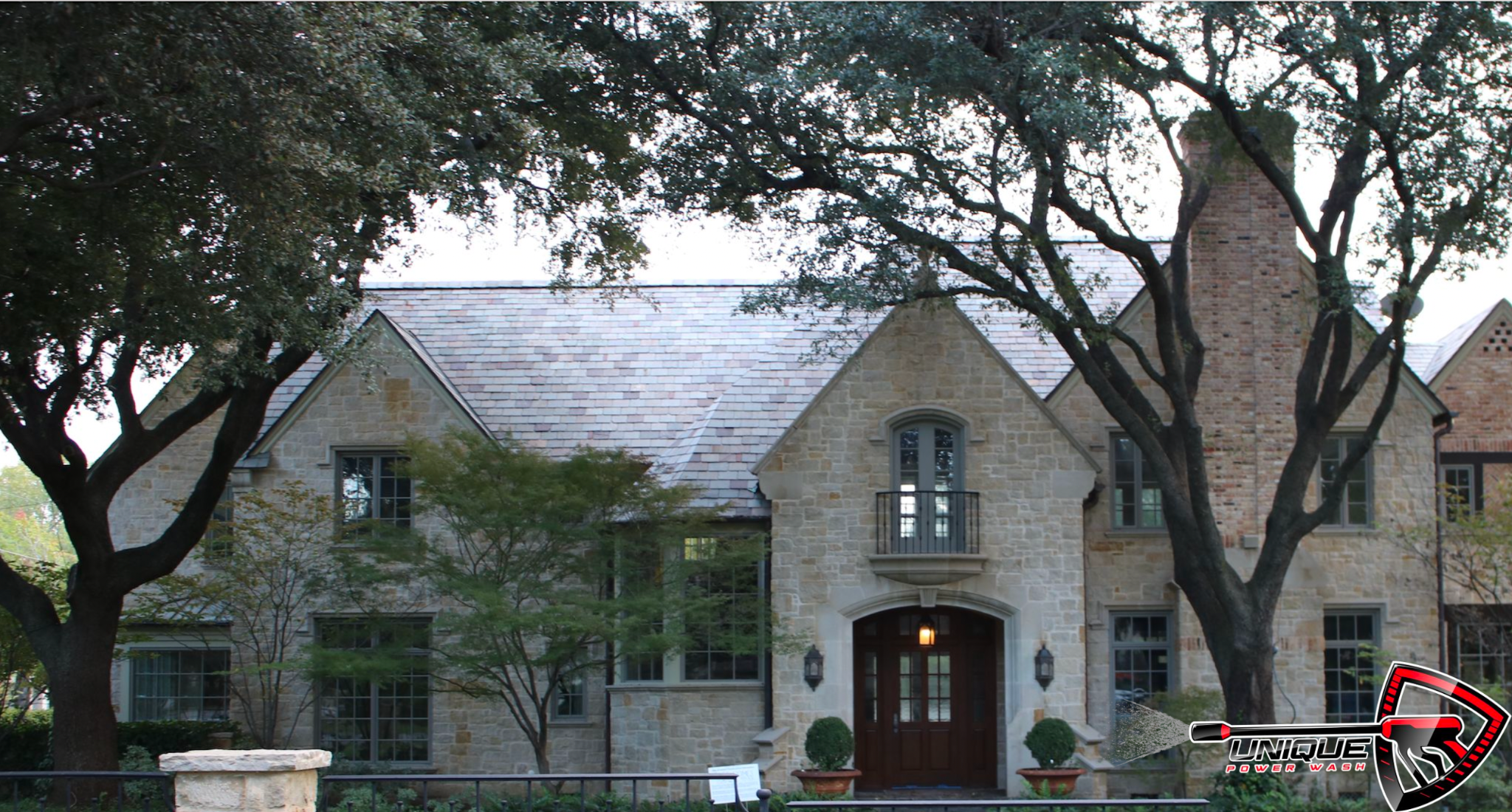 Restored limestone exterior and slate-tile roof at 5558 Edlen Drive after Unique Power Wash soft washing
