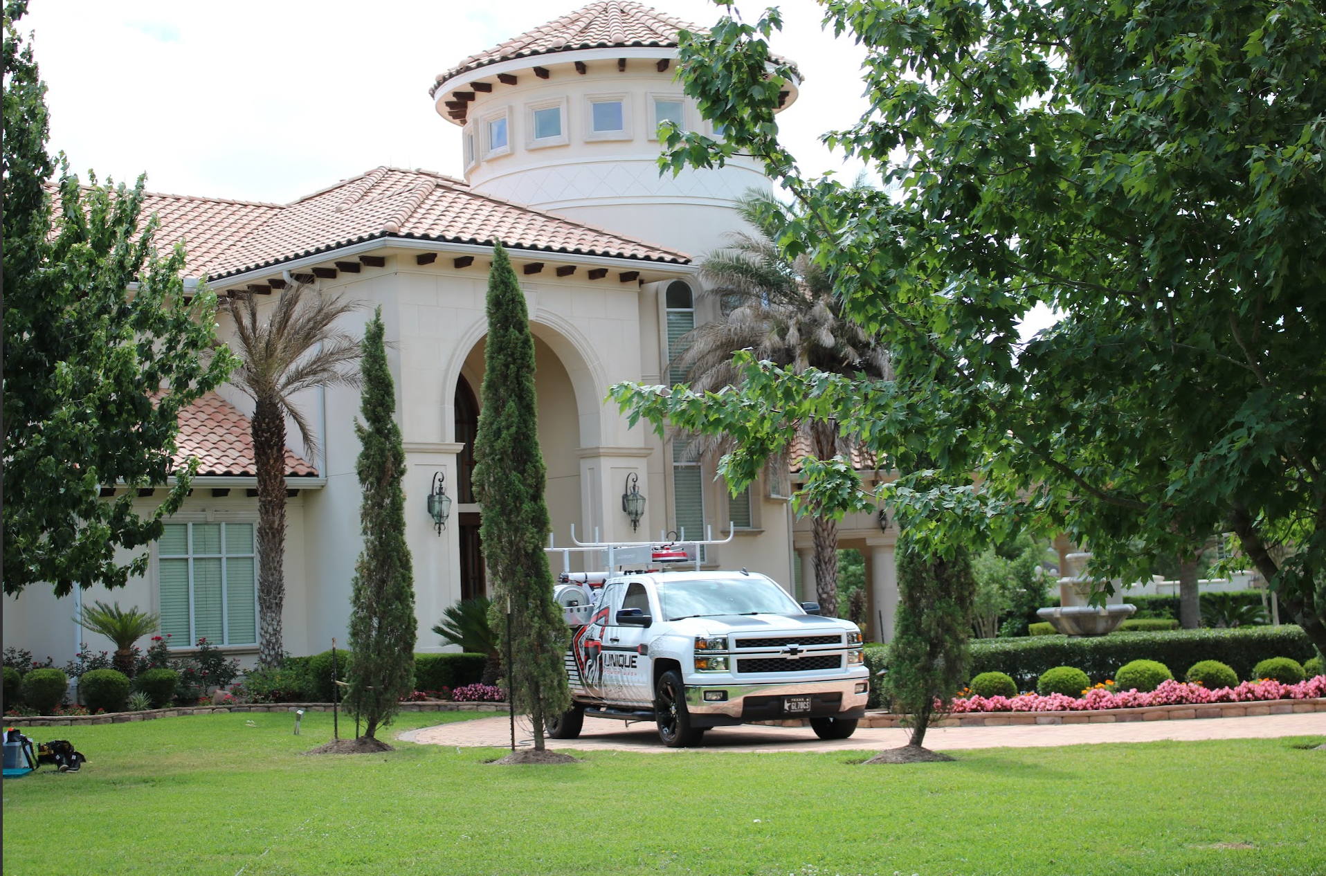 Original Unique Power Wash truck positioned in front of the estate