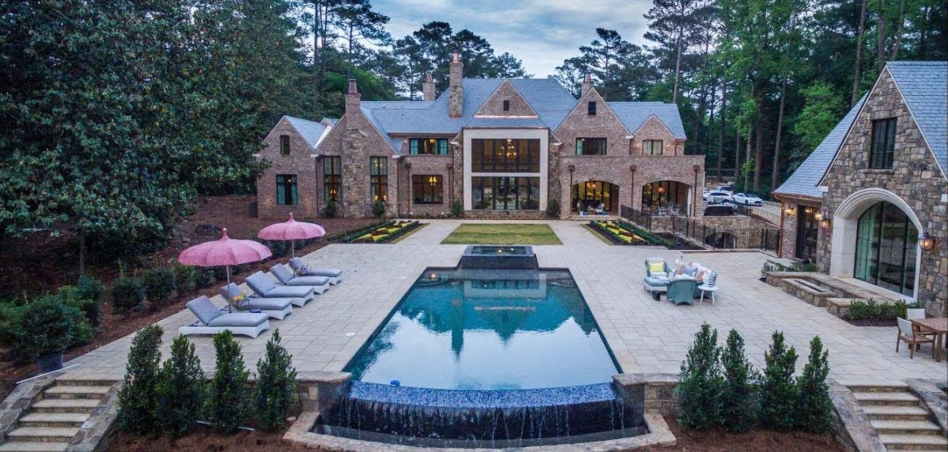 Rear aerial view of the Northside Drive estate, pool, slate roof and grounds